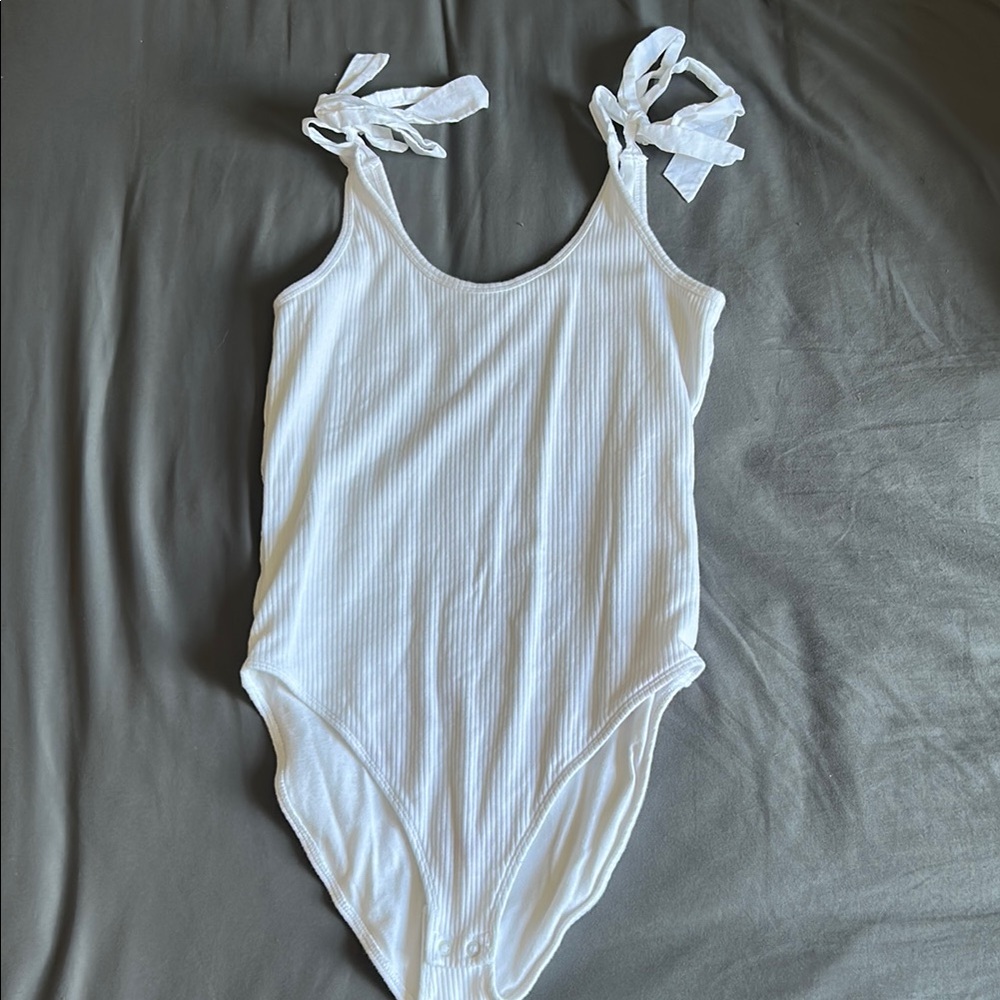 White bodysuit, bow tie straps